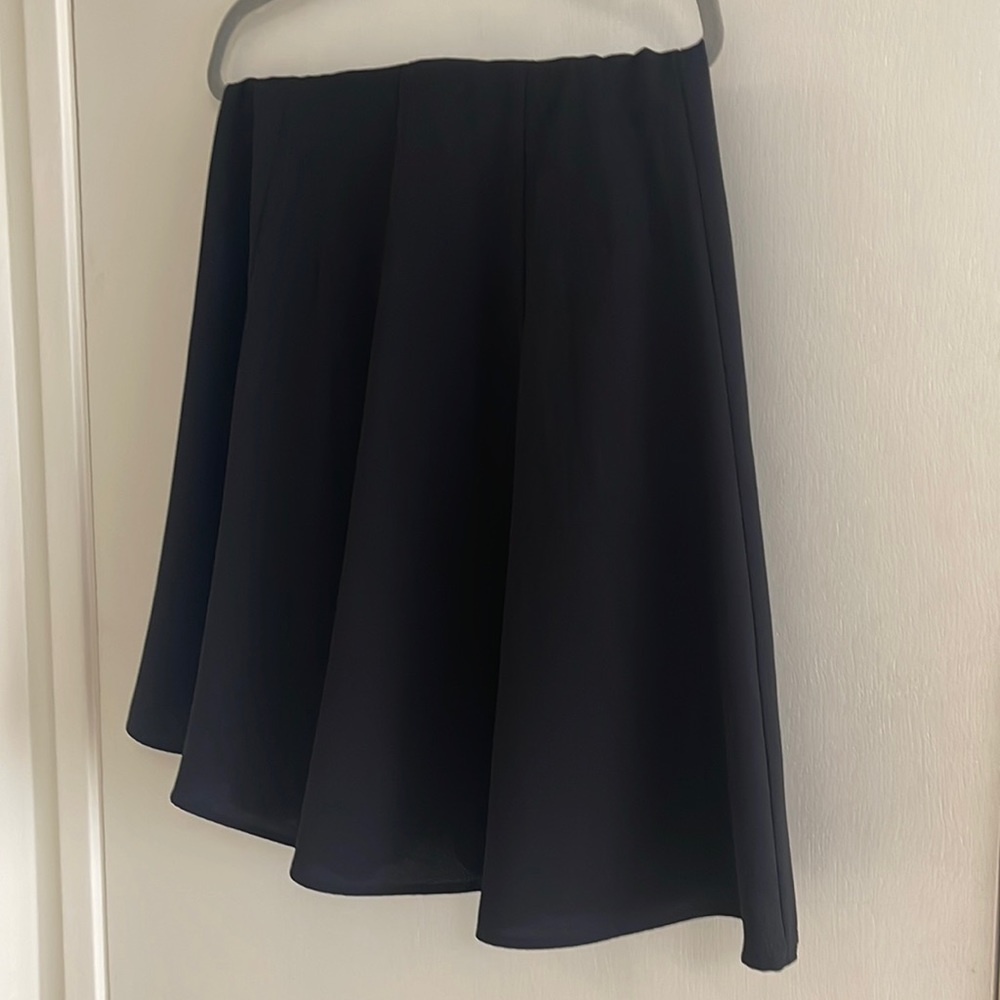 Black A line skirt. Very cute on. New, worn once for a few hours.